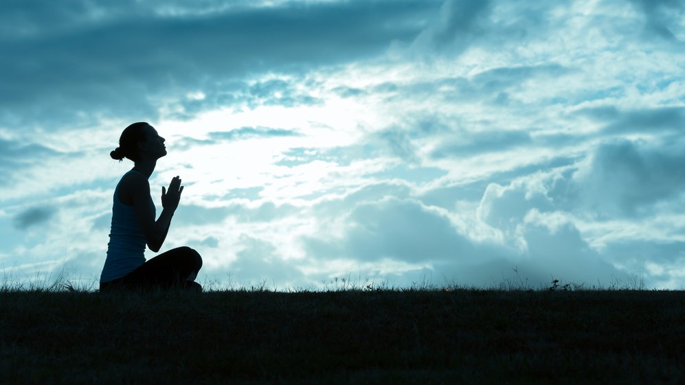 Young woman praying.